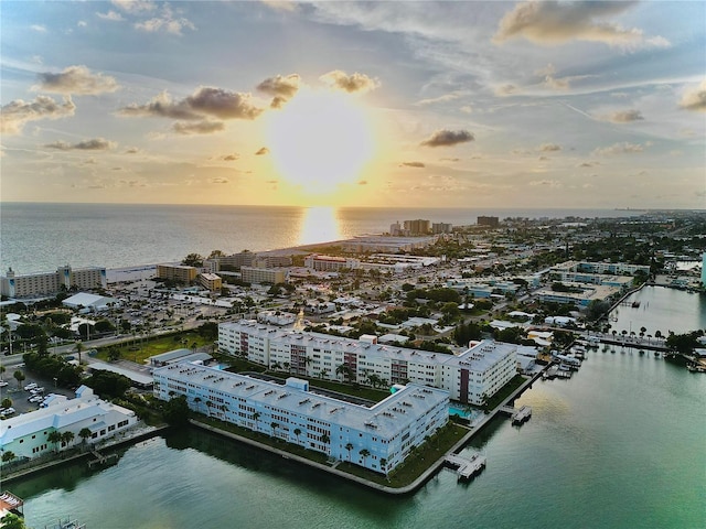 aerial view at dusk with a water view