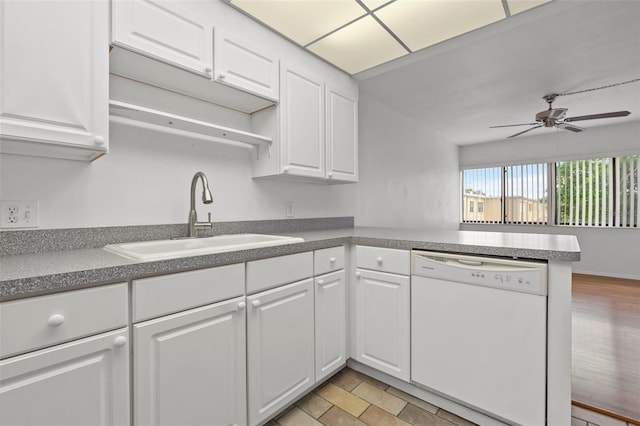 kitchen with kitchen peninsula, sink, white cabinets, ceiling fan, and white dishwasher