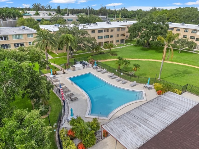 view of swimming pool with a yard and a patio area