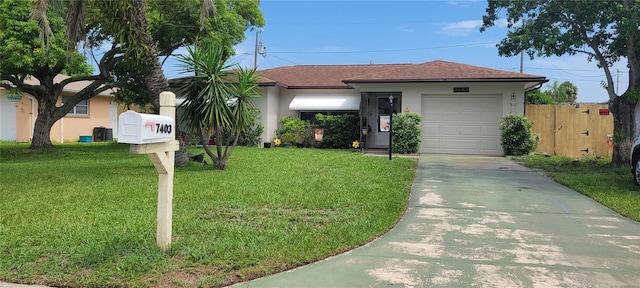 single story home with a front yard and a garage