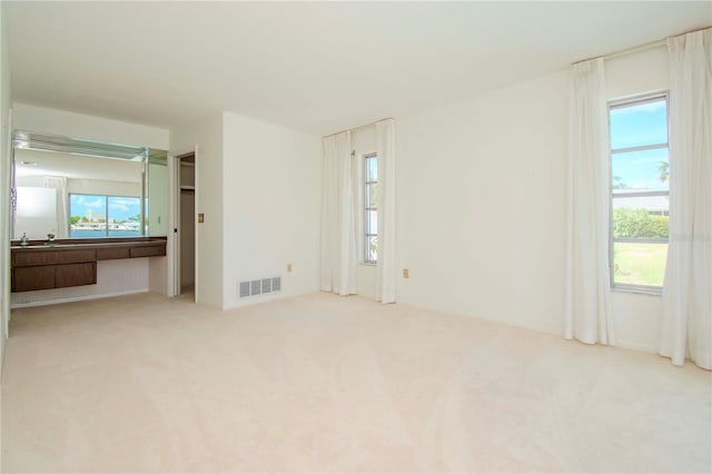 unfurnished bedroom with light carpet