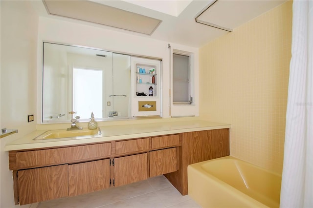 bathroom featuring tile patterned flooring and vanity