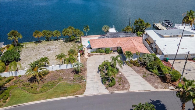 birds eye view of property with a water view