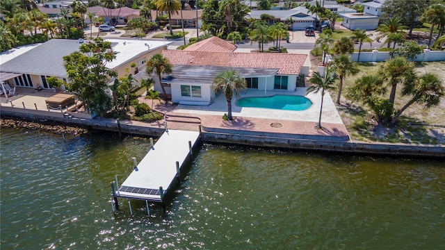 exterior space featuring a water view and a patio area