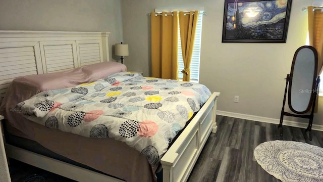 bedroom with dark wood-type flooring