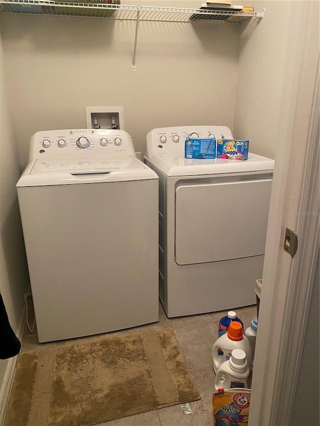 washroom with independent washer and dryer