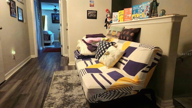 bedroom with dark hardwood / wood-style flooring