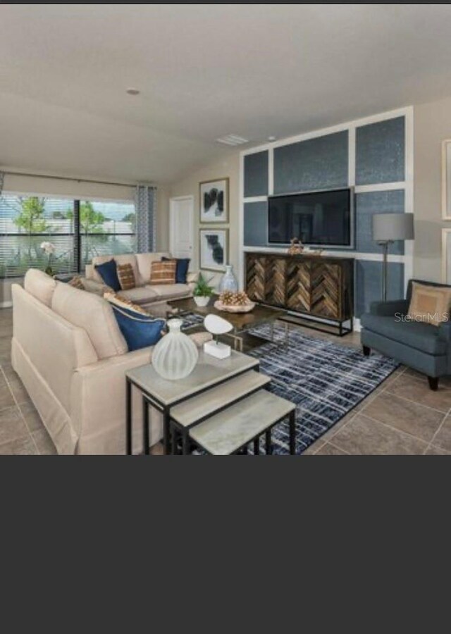 living room featuring vaulted ceiling