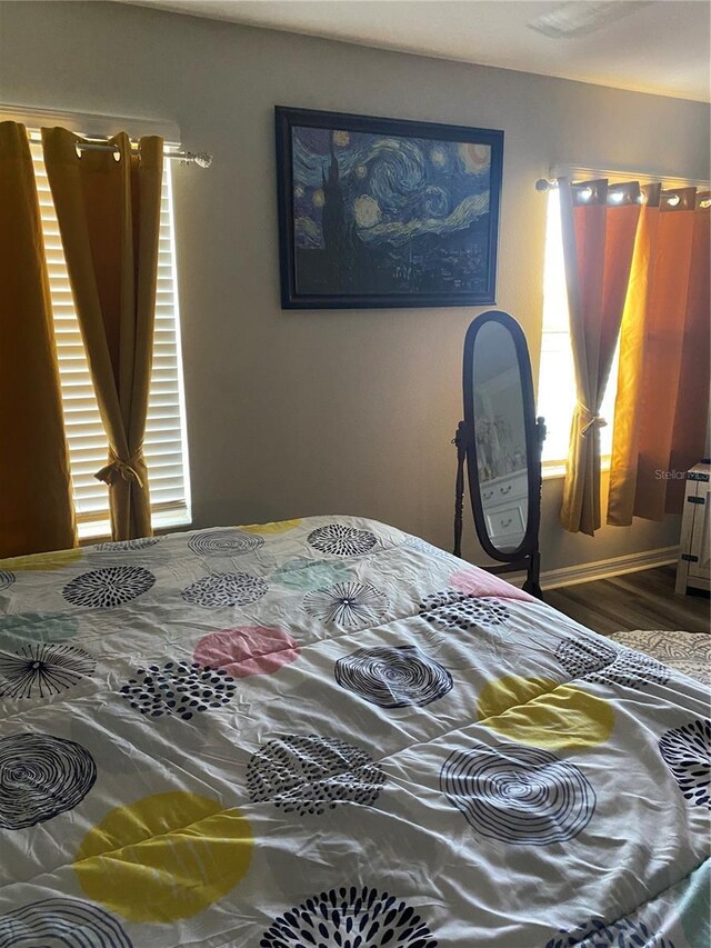 bedroom featuring dark hardwood / wood-style flooring