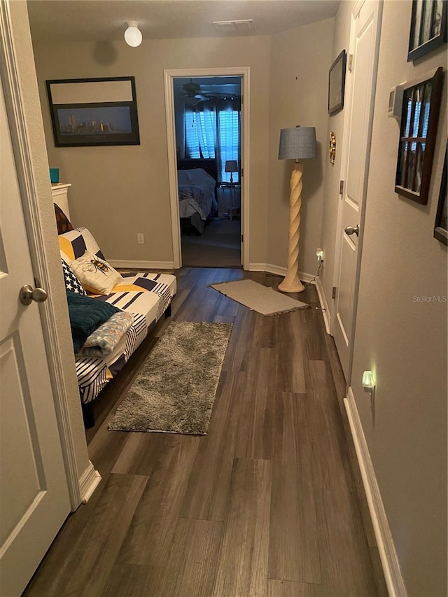 corridor featuring dark hardwood / wood-style flooring