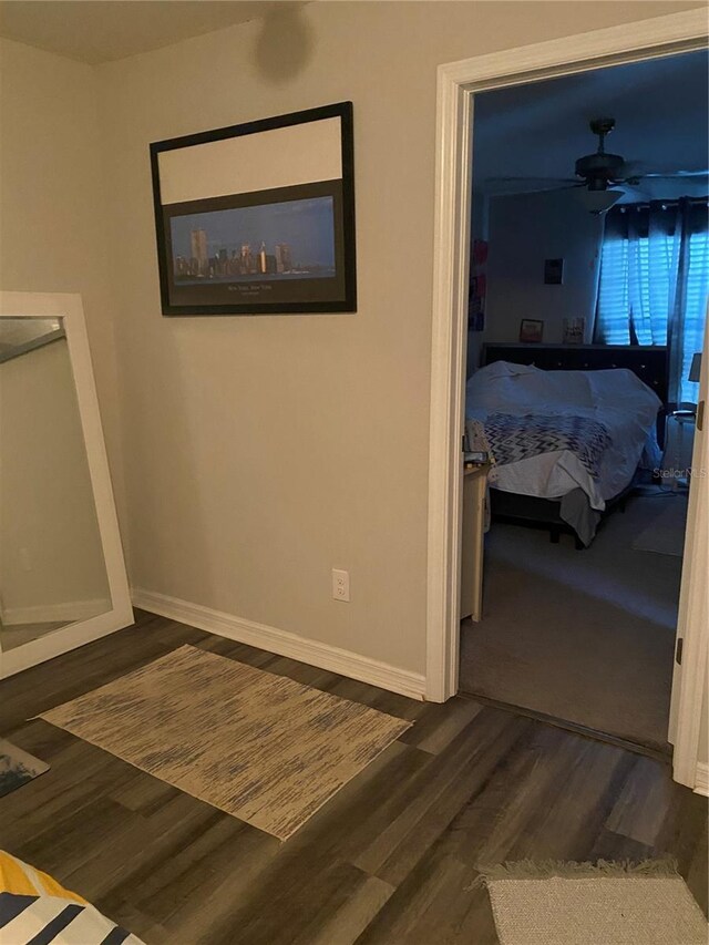 hallway featuring dark hardwood / wood-style floors