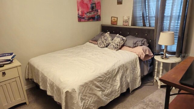 bedroom featuring carpet