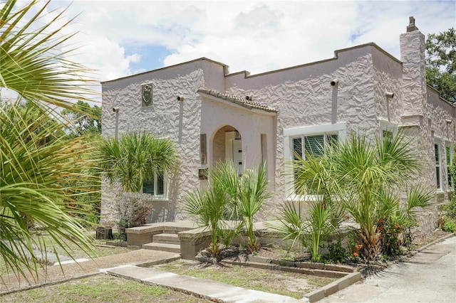 mediterranean / spanish-style home with stucco siding