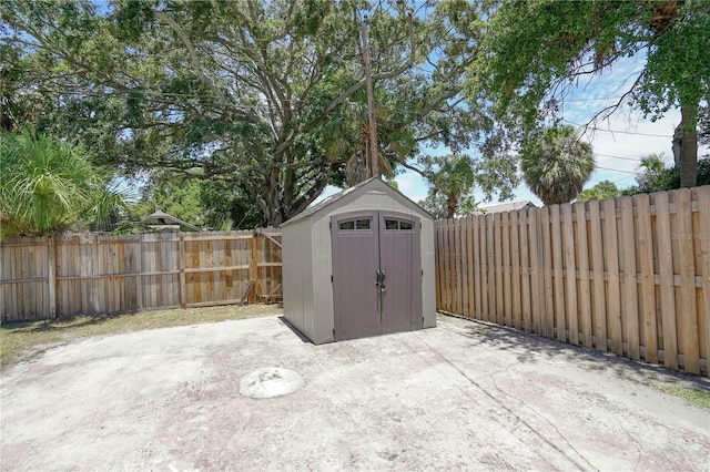 view of patio featuring a storage unit