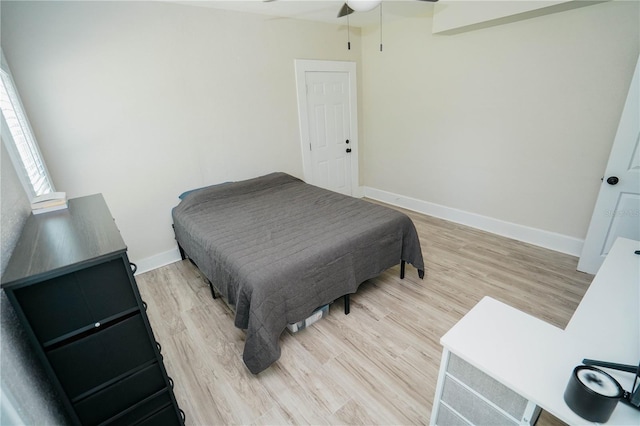 bedroom featuring ceiling fan and hardwood / wood-style flooring