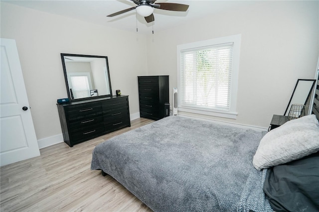 bedroom featuring ceiling fan and light hardwood / wood-style flooring