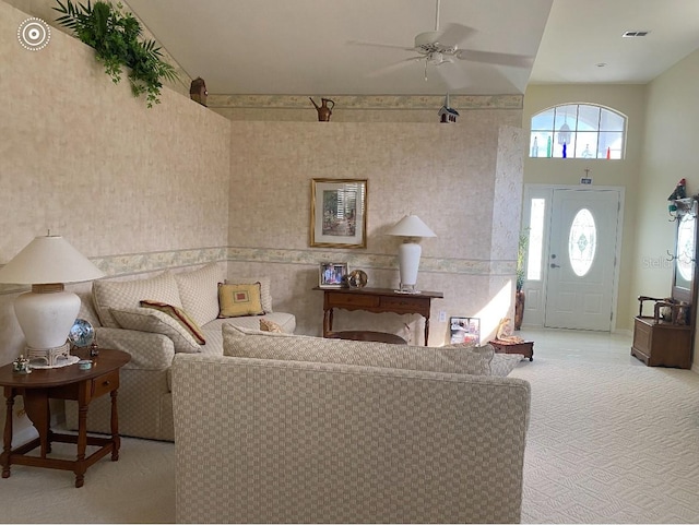 living room featuring carpet flooring and ceiling fan