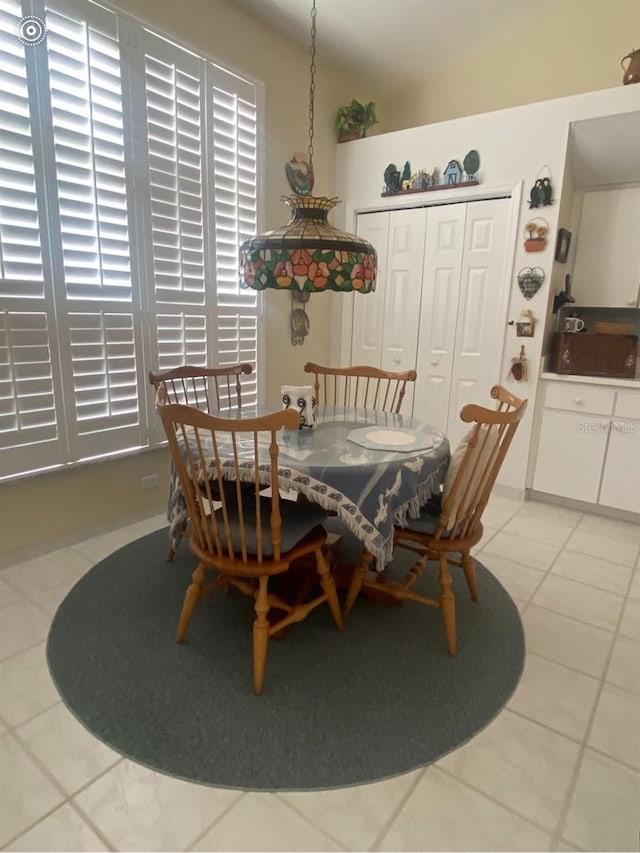 tiled dining area featuring sink