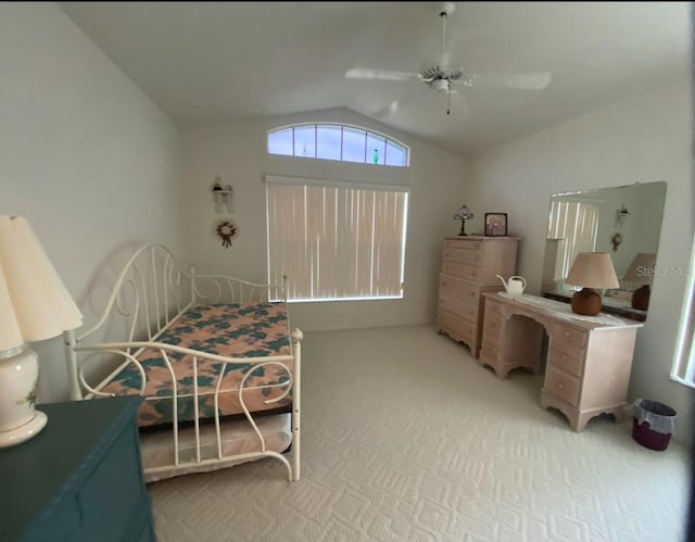 carpeted bedroom with vaulted ceiling and ceiling fan