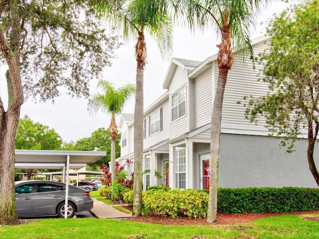 view of home's exterior featuring a carport