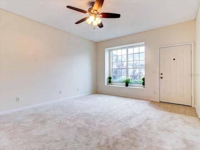 interior space featuring a textured ceiling and ceiling fan