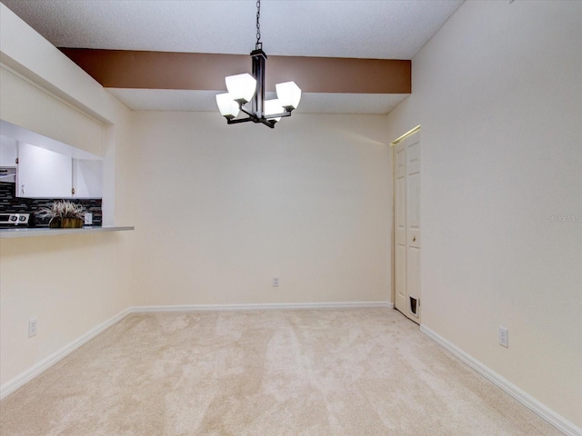 interior space with carpet floors and a notable chandelier