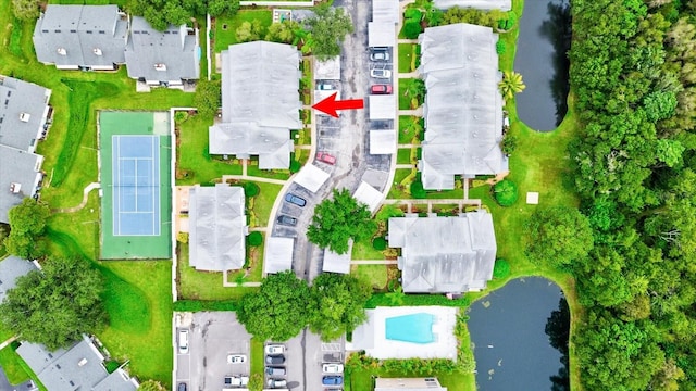 birds eye view of property featuring a water view