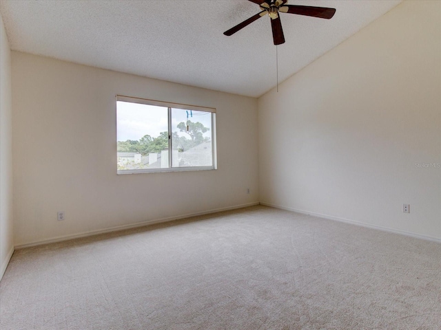 carpeted empty room with a textured ceiling and ceiling fan