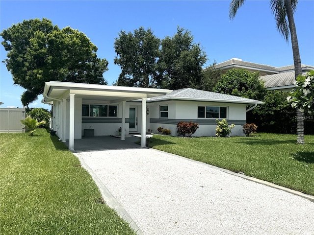 ranch-style house with a front lawn and a carport