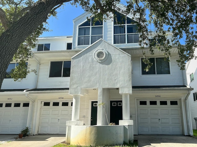 townhome / multi-family property with a garage