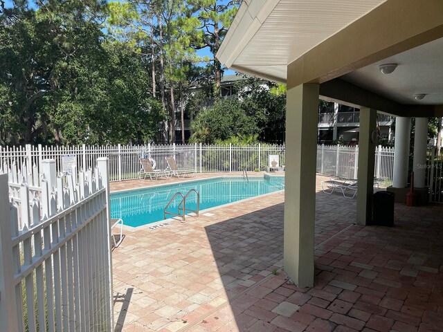 view of pool featuring a patio