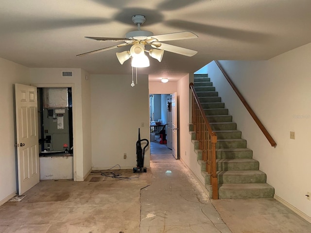 stairs with heating unit and ceiling fan