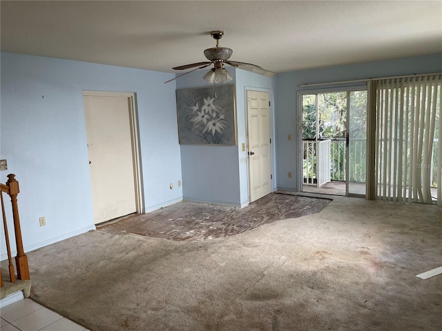 unfurnished living room with ceiling fan