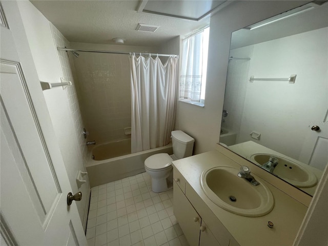 full bathroom with shower / bath combo with shower curtain, toilet, vanity, and tile patterned flooring