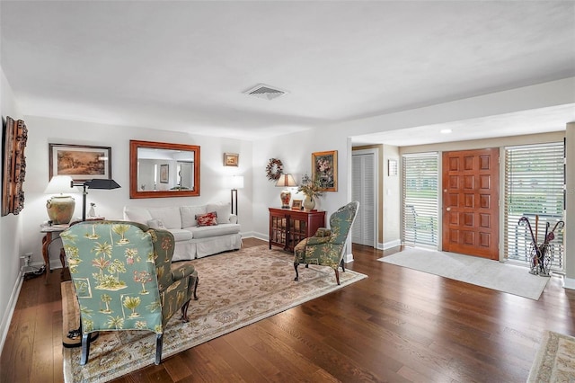 living room featuring dark hardwood / wood-style flooring