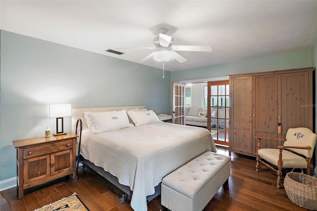 bedroom with ceiling fan and dark hardwood / wood-style floors