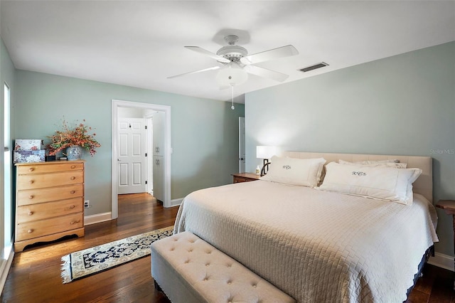 bedroom featuring ceiling fan and dark hardwood / wood-style floors