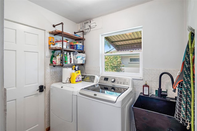 laundry room featuring washer and dryer and sink