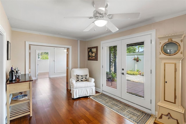 foyer entrance featuring dark hardwood / wood-style floors, plenty of natural light, crown molding, and french doors