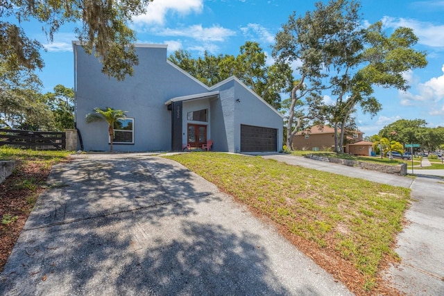 view of front facade featuring a garage and a front yard