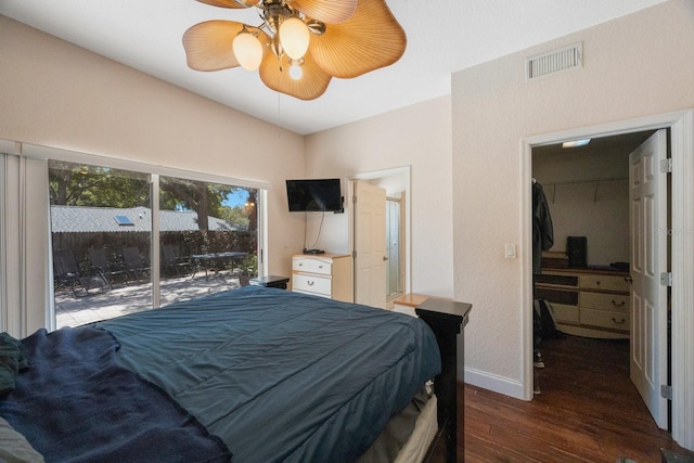 bedroom featuring dark hardwood / wood-style floors, a spacious closet, access to outside, ceiling fan, and a closet