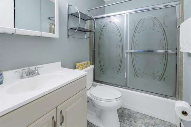 full bathroom featuring vanity, toilet, and enclosed tub / shower combo