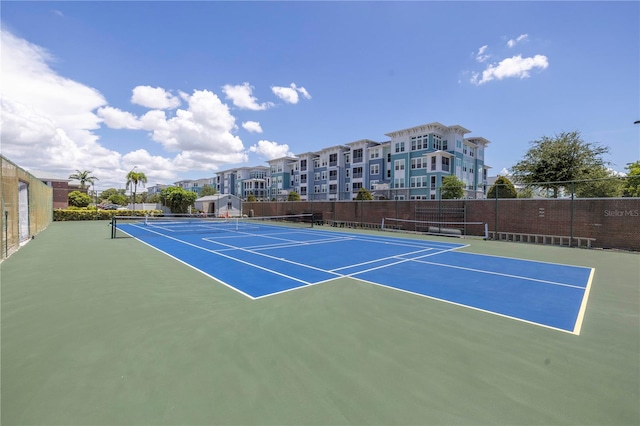 view of sport court featuring basketball hoop