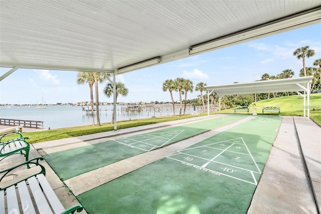 surrounding community featuring a yard and a water view