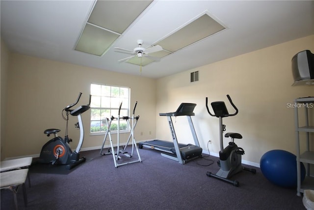 exercise room with ceiling fan