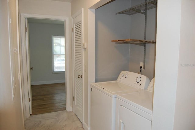 washroom with independent washer and dryer