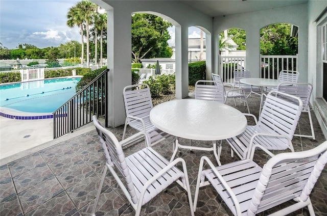 view of patio with a community pool