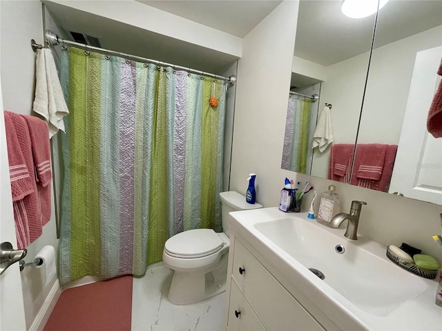 bathroom featuring vanity, toilet, and tile patterned flooring