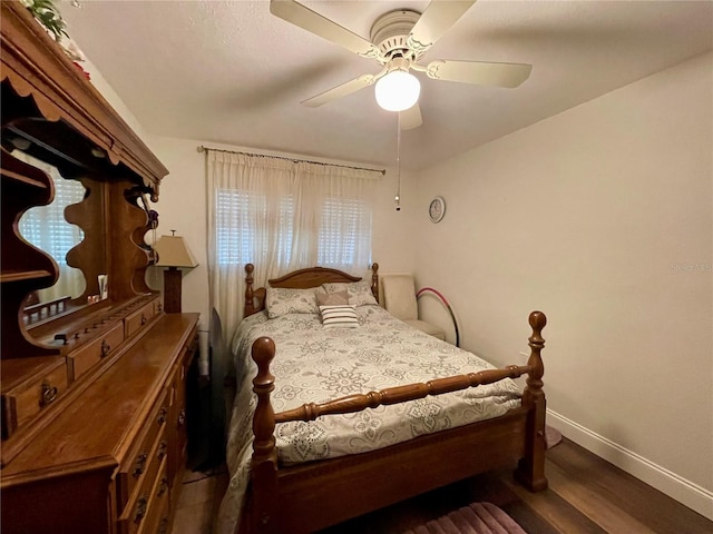 bedroom with wood-type flooring and ceiling fan