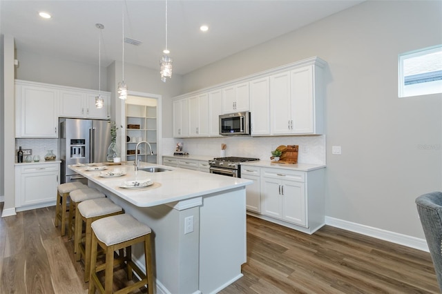 kitchen with sink, white cabinetry, and appliances with stainless steel finishes